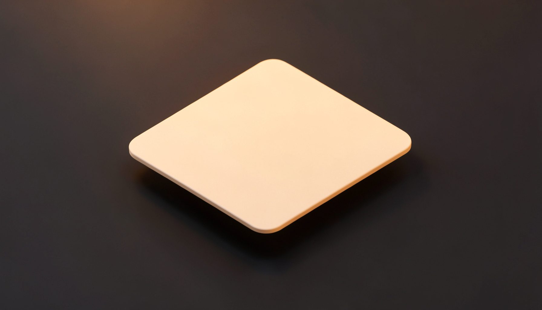 Soft cream-colored card with rounded corners floating above a deep charcoal surface, conveying a clean and cozy brand feel